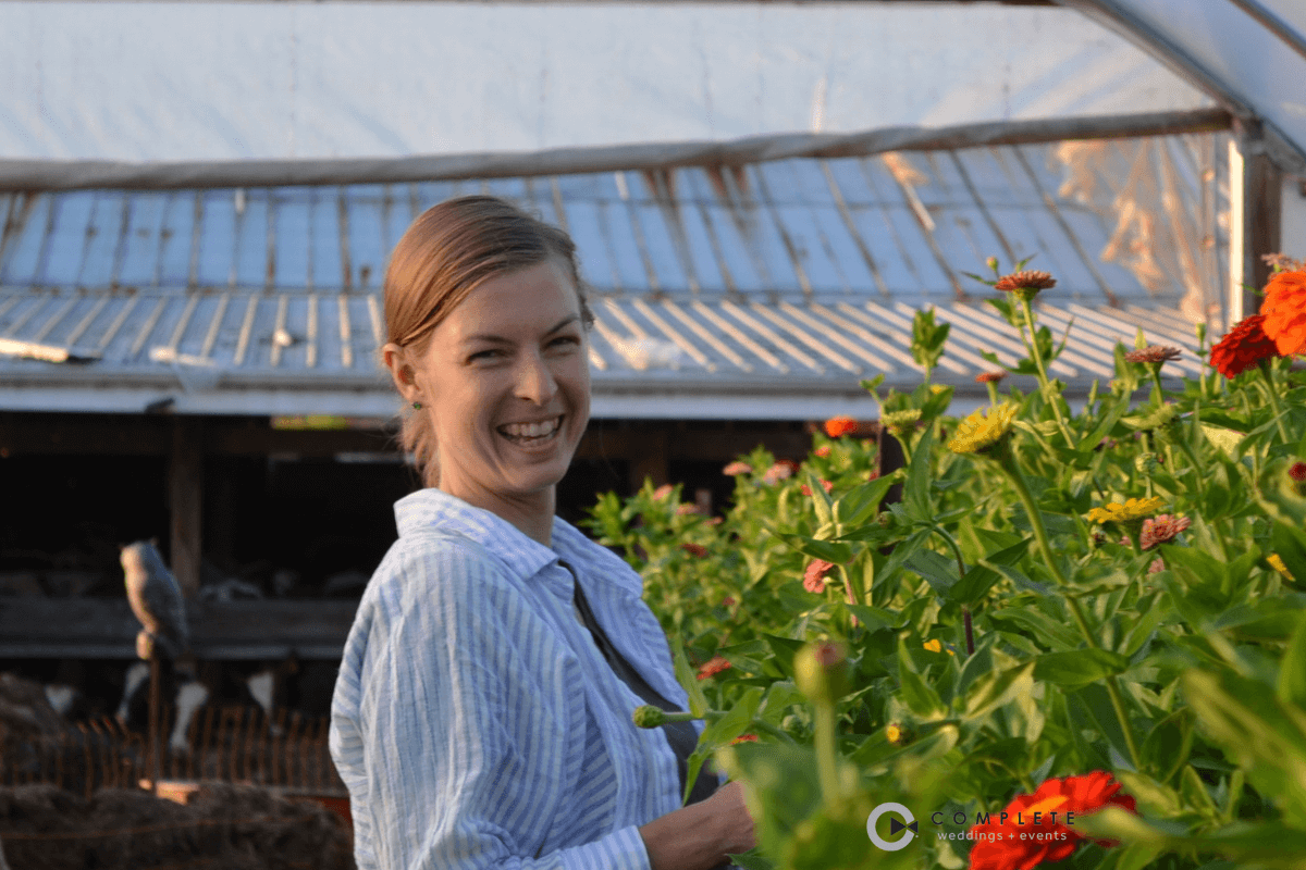 anna merkt headshot in greenhouse with a big smile